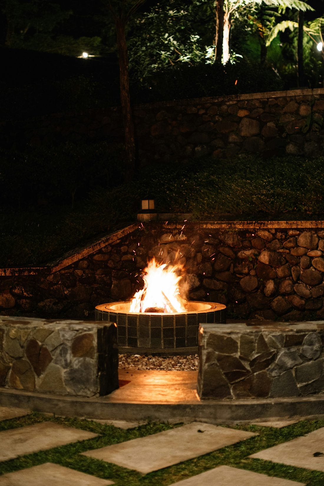 Stone fire pit on a paver patio